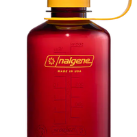 Red Nalgene water bottle with yellow lid on a white background