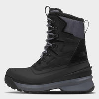 Black winter boot with gray sole on a white background