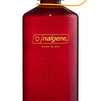 Red Nalgene bottle with yellow cap on a white background