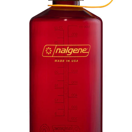 Red Nalgene bottle with yellow cap on a white background