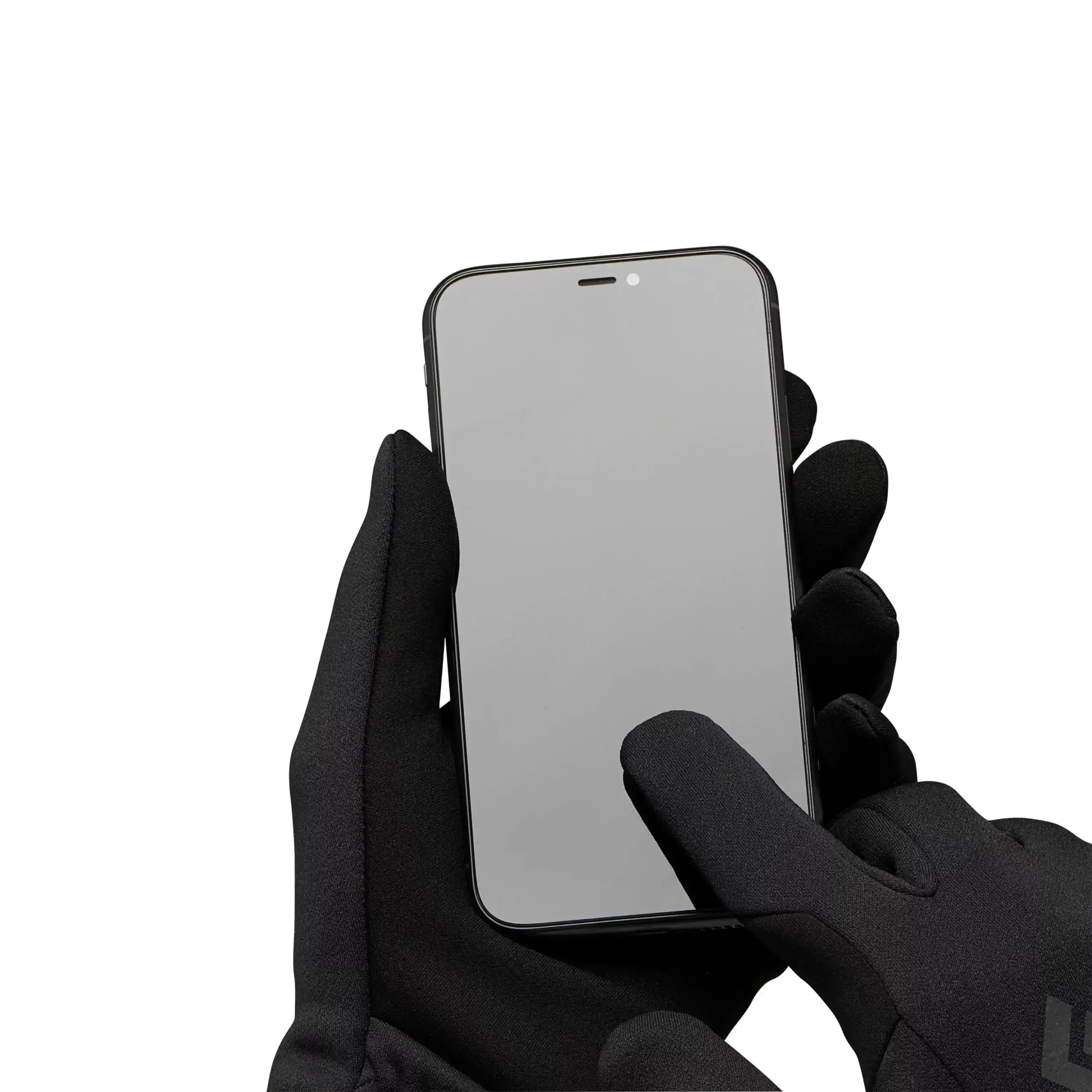 Hand wearing a black glove holding a smartphone with a reflective screen on a white background