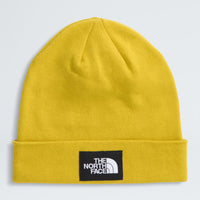 Yellow beanie with The North Face logo on a light gray background