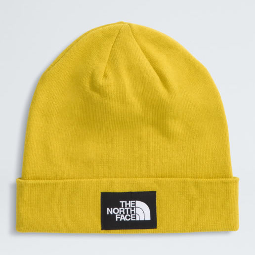 Yellow beanie with The North Face logo on a light gray background