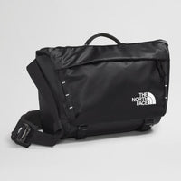 Black The North Face bag on a light gray background