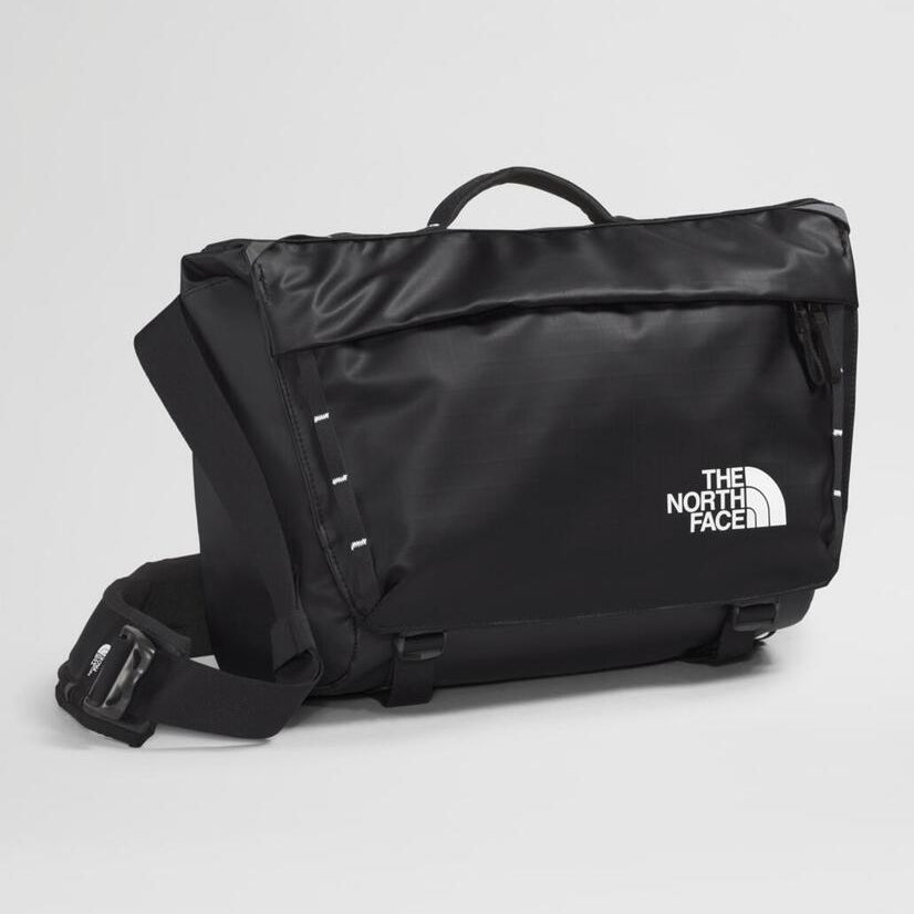 Black The North Face bag on a light gray background