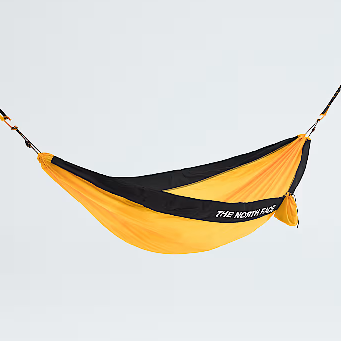 Yellow and black hammock with 'The North Face' logo on a light gray background